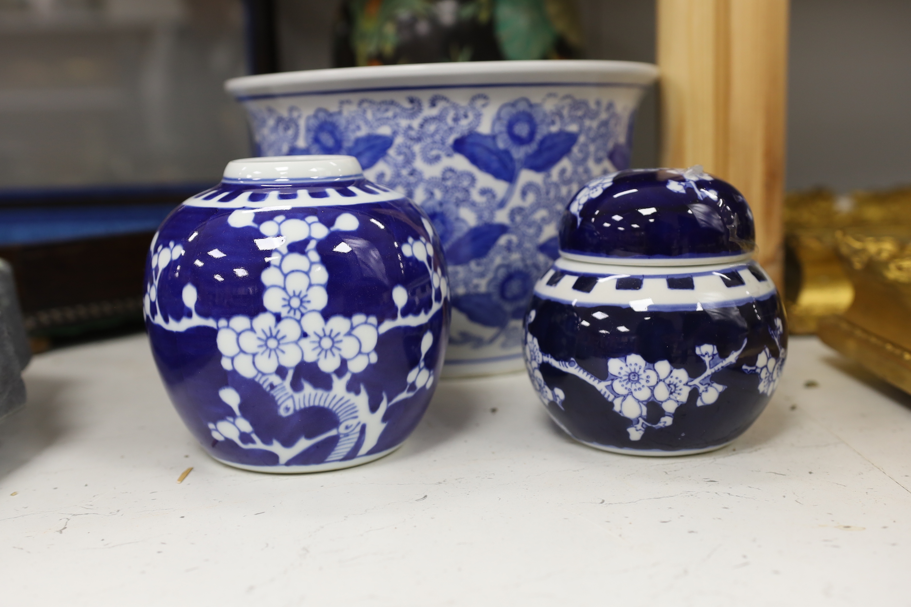 A Chinese famille noire vase and cover, three ginger jars and a jardiniere, largest 33cm